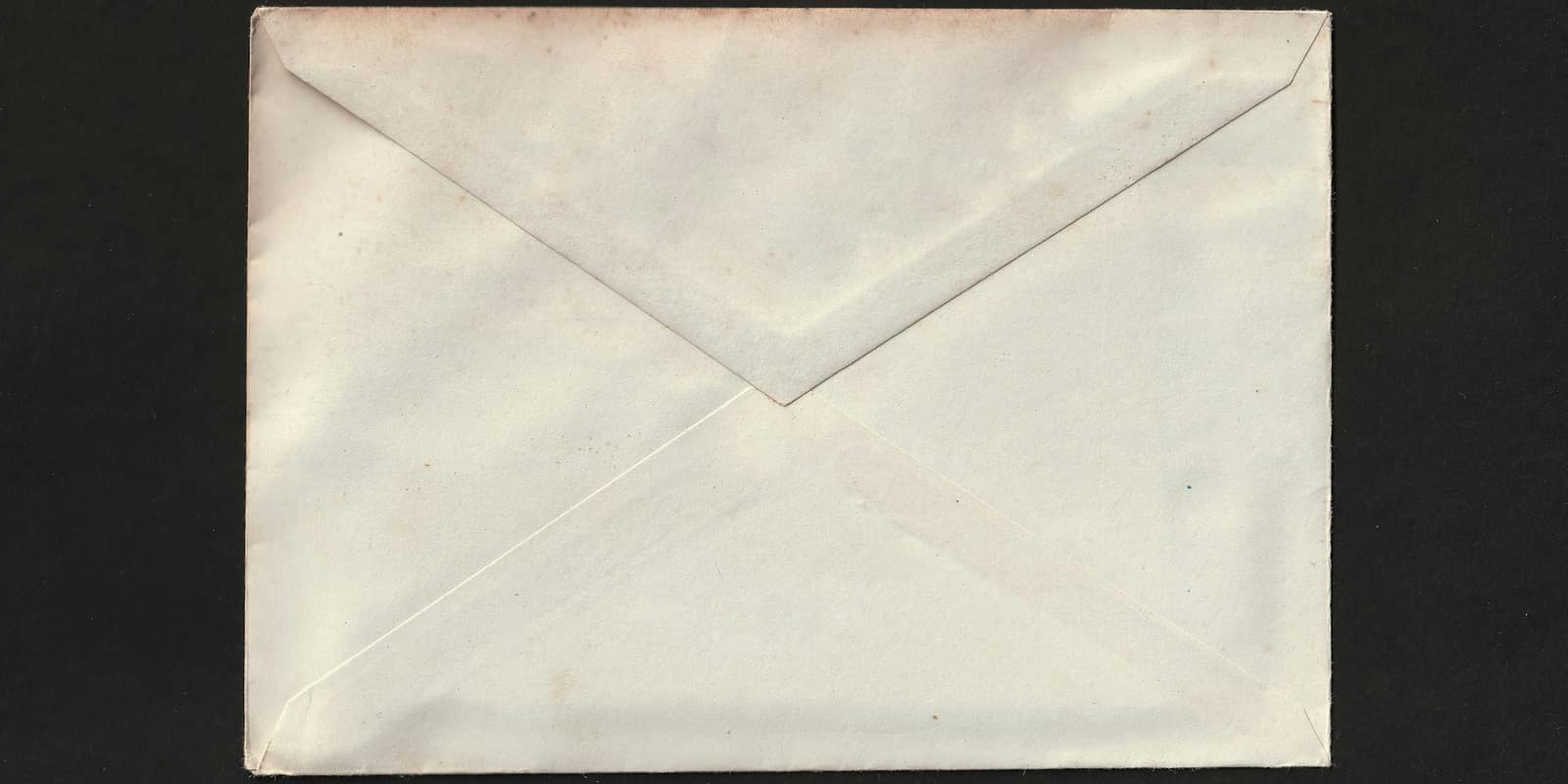 A white envelope on a black background