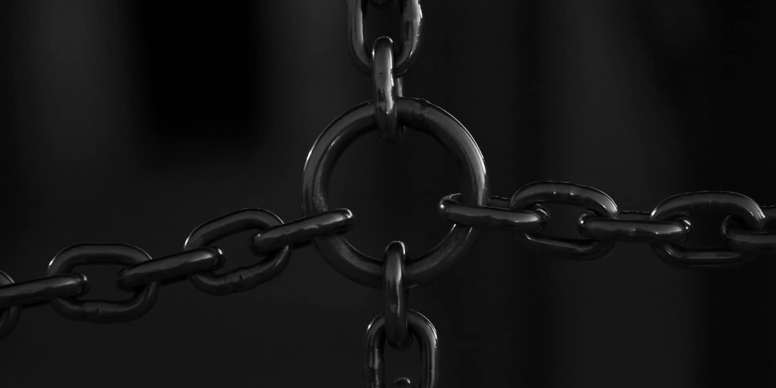 Silver chain links on a black background